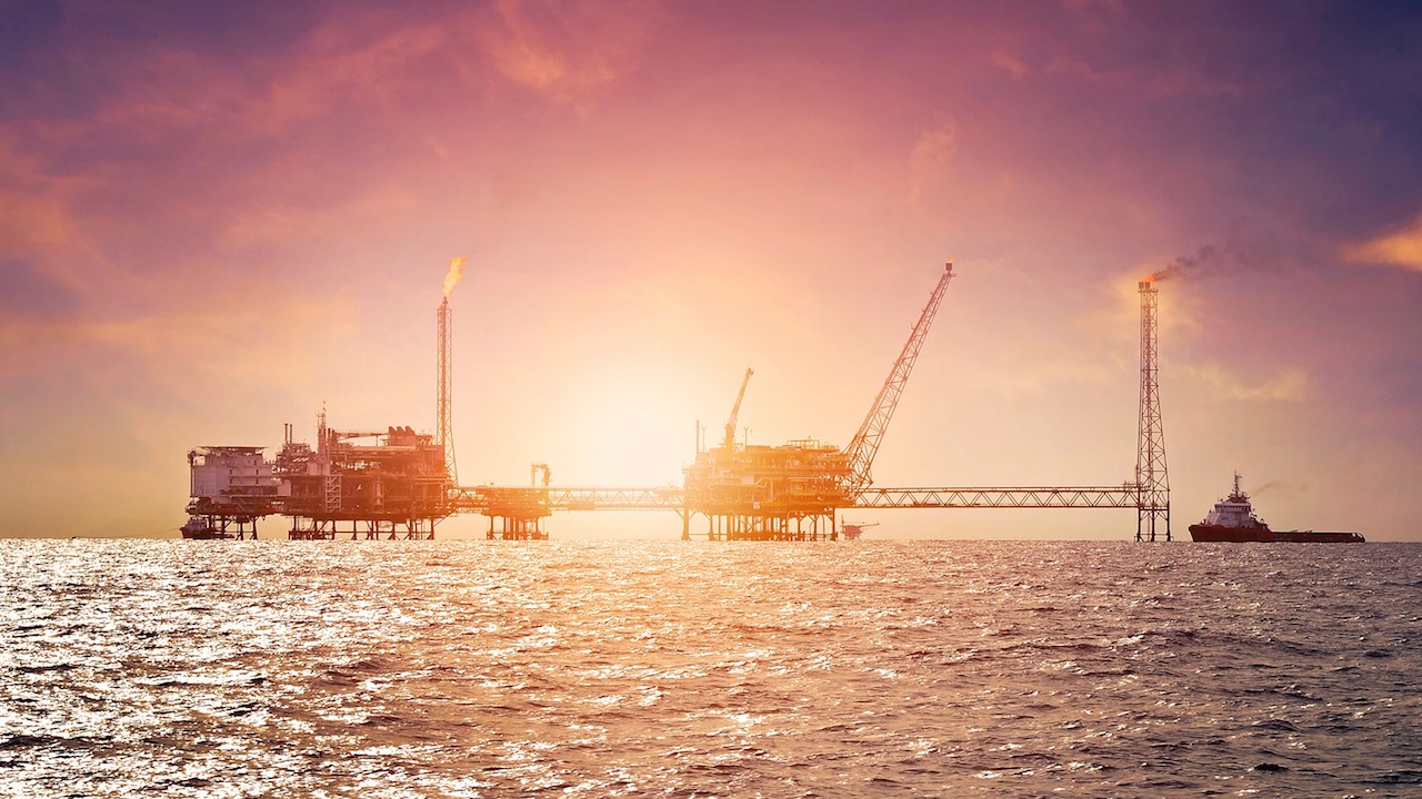 Offshore construction platform for production oil and gas in gulf of Thailand at sunset